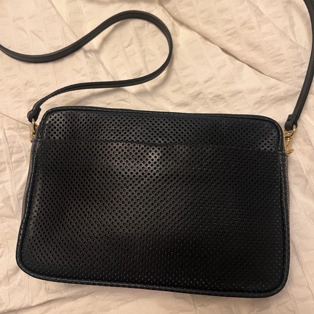 Clare V. Marisol in perforated navy leather.